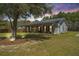 Charming home with a metal roof, welcoming front porch and rocking chairs for enjoying the outdoors at 508 Horse Trail Rd, Saint George, SC 29477