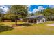 Charming home with a metal roof, welcoming front porch, and a spacious, well-manicured lawn at 508 Horse Trail Rd, Saint George, SC 29477
