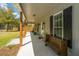Inviting front porch with bench seating, stylish decor, and a welcoming entrance at 508 Horse Trail Rd, Saint George, SC 29477