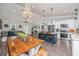 Bright and airy kitchen and living room with white cabinets and wood accents at 508 Horse Trail Rd, Saint George, SC 29477