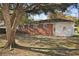 Backyard featuring a brick home and mature trees at 5314 Albert St, North Charleston, SC 29418