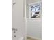 Classic white tiled bathroom with a tub/shower combination and window at 5314 Albert St, North Charleston, SC 29418