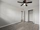 Bedroom with a fan, wood-look flooring, and an open doorway at 5314 Albert St, North Charleston, SC 29418