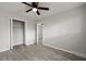 Bedroom features wood-look flooring, closet, and access to another room at 5314 Albert St, North Charleston, SC 29418