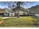 Beautiful home with a well-manicured lawn and a charming brick and white exterior at 5314 Albert St, North Charleston, SC 29418