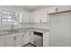 Updated kitchen features stainless steel appliances, granite counters, and white cabinets at 5314 Albert St, North Charleston, SC 29418