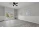 Open living space with modern gray flooring and updated lighting fixture at 5314 Albert St, North Charleston, SC 29418