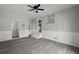 Open living space with modern gray flooring and updated lighting fixture at 5314 Albert St, North Charleston, SC 29418