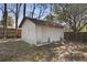 Backyard shed with mature trees and grass at 5314 Albert St, North Charleston, SC 29418
