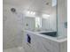 A luxurious bathroom with a spacious shower area, white marble tiling, and double vanity sinks at 5525 Alpine Dr, Summerville, SC 29483