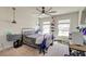 Bright bedroom featuring modern ceiling fan, natural light, and neutral walls at 5525 Alpine Dr, Summerville, SC 29483