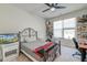 Cozy bedroom featuring wrought-iron bed, flatscreen tv, and natural light at 5525 Alpine Dr, Summerville, SC 29483