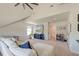 Large bonus room with vaulted ceilings, TV, and a large sectional, perfect for relaxation at 5525 Alpine Dr, Summerville, SC 29483