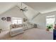 Spacious bonus room with vaulted ceilings, a ceiling fan, comfortable seating, and natural light at 5525 Alpine Dr, Summerville, SC 29483