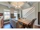 Elegant dining room with coffered ceilings, chandelier lighting, and wainscoting at 5525 Alpine Dr, Summerville, SC 29483
