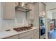 Gourmet kitchen showcasing stainless steel oven, gas range, subway tile backsplash, and ample storage at 5525 Alpine Dr, Summerville, SC 29483