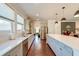 Spacious kitchen features stainless steel appliances, white cabinets and subway tile backsplash, open to the living area at 5525 Alpine Dr, Summerville, SC 29483