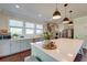 Bright, open kitchen boasts quartz countertops, stainless appliances, and ample cabinet space at 5525 Alpine Dr, Summerville, SC 29483