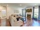 Spacious living room offers hardwood floors, natural light, fireplace, and tasteful decor at 5525 Alpine Dr, Summerville, SC 29483