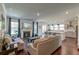 Open concept living room featuring a fireplace, hardwood floors, and seamless flow to kitchen at 5525 Alpine Dr, Summerville, SC 29483