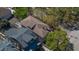 Aerial view of the home showcasing the roofline, trees, and landscaping from above at 56 Parkwood Ave, Charleston, SC 29403
