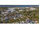 Aerial shot of the neighborhood showcasing the rooftops of nearby houses, mature trees, and buildings in the distance at 56 Parkwood Ave, Charleston, SC 29403