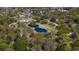Expansive aerial view showcases the park with a picturesque pond and walking paths at 56 Parkwood Ave, Charleston, SC 29403
