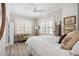 Comfortable bedroom space with white brick accent wall, neutral color palette, and lots of natural light at 56 Parkwood Ave, Charleston, SC 29403