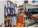 Organized walk-in closet with built-in shelving, drawers and hanging rods, providing ample storage at 56 Parkwood Ave, Charleston, SC 29403