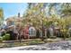 Beautiful brick home with arched windows and mature trees at 56 Parkwood Ave, Charleston, SC 29403