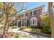 Elegant brick home showcasing classic architectural details and lush landscaping at 56 Parkwood Ave, Charleston, SC 29403