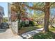 Charming brick home with a well-maintained lawn and a classic white picket fence at 56 Parkwood Ave, Charleston, SC 29403