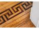 Close-up of the beautiful parquet wood flooring in the home with an elaborate design pattern at 56 Parkwood Ave, Charleston, SC 29403