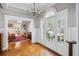 Elegant foyer featuring hardwood floors, an arched entrance, and an exquisite chandelier at 56 Parkwood Ave, Charleston, SC 29403