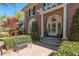 Charming brick home featuring an inviting entrance with a pergola and manicured landscaping at 56 Parkwood Ave, Charleston, SC 29403
