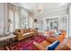 Inviting living room with hardwood floors, neutral decor, and abundant natural light at 56 Parkwood Ave, Charleston, SC 29403