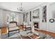 Bright living room with fireplace, custom built-ins, hardwood floors, and natural light at 56 Parkwood Ave, Charleston, SC 29403