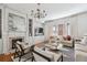 Bright living room featuring a decorative fireplace, television, and plush seating for relaxing and entertaining at 56 Parkwood Ave, Charleston, SC 29403