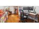 Home office with hardwood floors and large computer monitor and desk, as well as comfortable leather seating at 56 Parkwood Ave, Charleston, SC 29403
