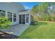 Well maintained backyard featuring a screened-in porch and a landscaped patio area at 566 Four Seasons Blvd, Summerville, SC 29486