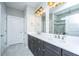 Bathroom featuring double vanity, modern lighting, and a tiled shower with a glass door at 566 Four Seasons Blvd, Summerville, SC 29486