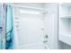 Bright bathroom with a shower-tub combo and built in storage shelves at 566 Four Seasons Blvd, Summerville, SC 29486