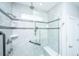 Modern bathroom featuring tiled shower, bench, and convenient grab bars at 566 Four Seasons Blvd, Summerville, SC 29486