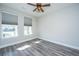 Bright bedroom featuring a ceiling fan, hardwood floors, and natural light at 566 Four Seasons Blvd, Summerville, SC 29486