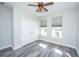 Bedroom showcasing hardwood floors, natural light, and a closet with double doors at 566 Four Seasons Blvd, Summerville, SC 29486