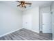 Cozy bedroom with grey flooring and a stylish ceiling fan and convenient closet doors at 566 Four Seasons Blvd, Summerville, SC 29486