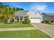 Inviting single-story home with a well-kept lawn and convenient two-car garage at 566 Four Seasons Blvd, Summerville, SC 29486