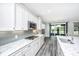 Modern kitchen with stainless steel appliances, a large island, and plenty of counter space at 566 Four Seasons Blvd, Summerville, SC 29486
