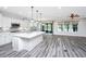 Spacious kitchen with a large island, stainless steel appliances, and a seamless transition to the dining area at 566 Four Seasons Blvd, Summerville, SC 29486