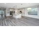 Bright kitchen featuring white cabinetry, stainless steel appliances and a center island at 566 Four Seasons Blvd, Summerville, SC 29486